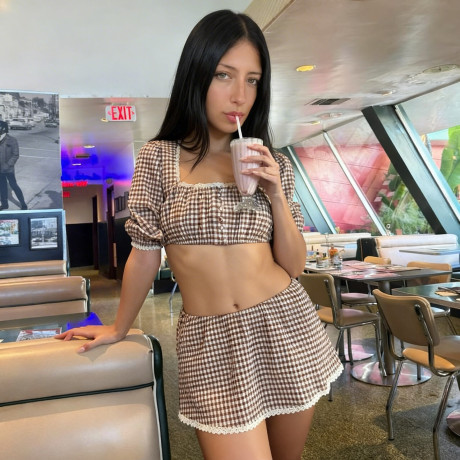 Brunette amateur takes selfie shots in a number of different outfits