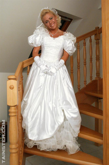 New bride dressed in her wedding dress plays water sport games at reception - #54974
