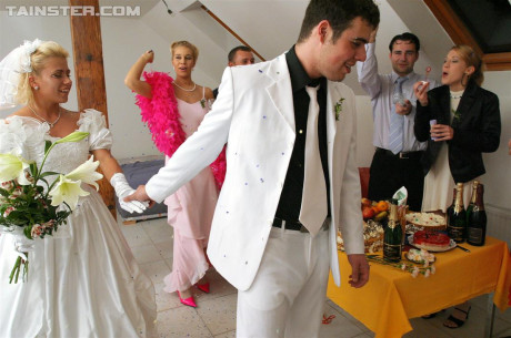 New bride dressed in her wedding dress plays water sport games at reception - #54975
