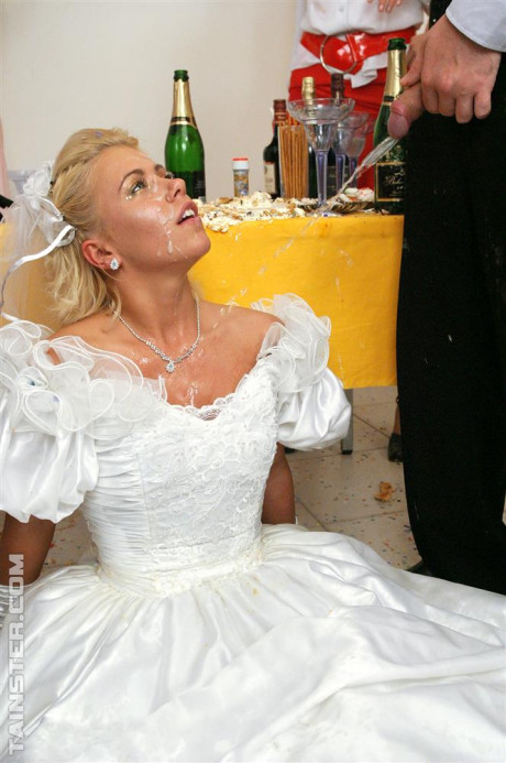 New bride dressed in her wedding dress plays water sport games at reception - #54985