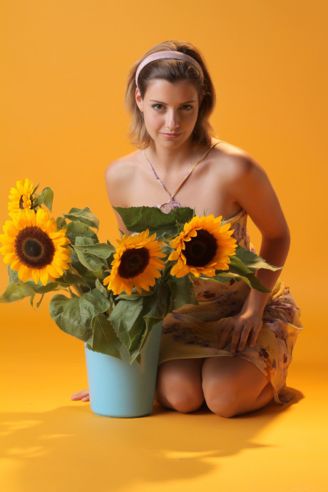 Sexy young sweetie Vienna flaunts her monstrous breasts and poses with sunflowers - #292486