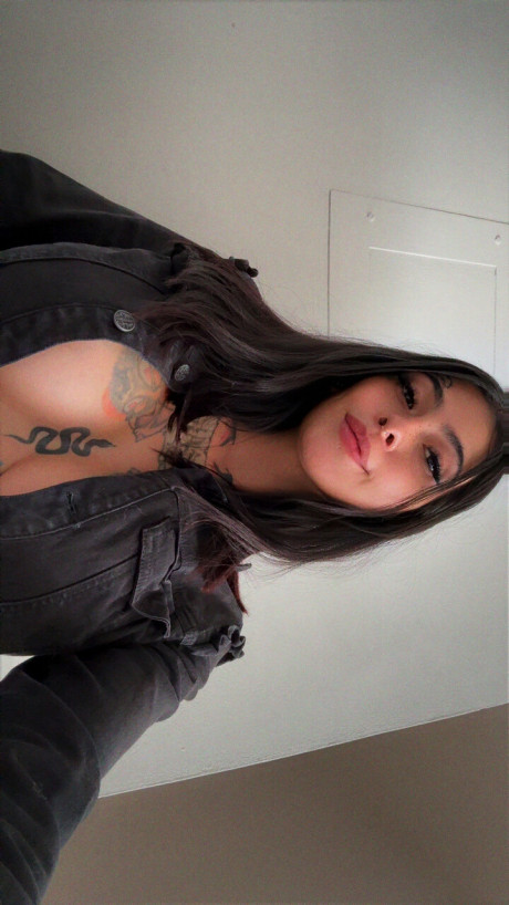 Brunette amateur shows her tattooed body while wearing a short denim skirt - #293896