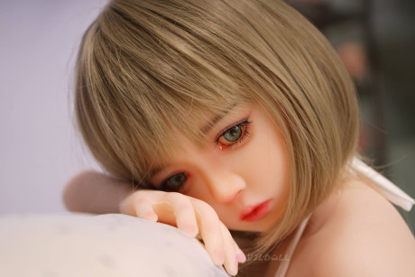 Sex doll with striking eyes and perky breasts gets naked on her knees - #278448