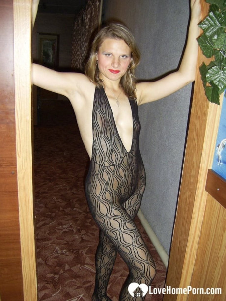 Dirty housewife with red lipstick poses in her bodystocking while vacuuming - #320687