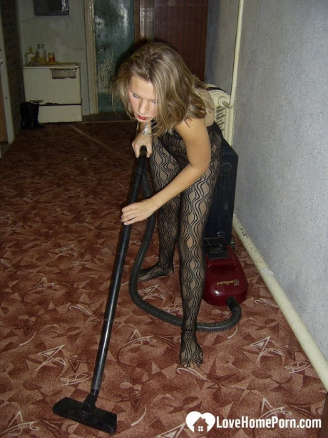 Dirty housewife with red lipstick poses in her bodystocking while vacuuming - #320697