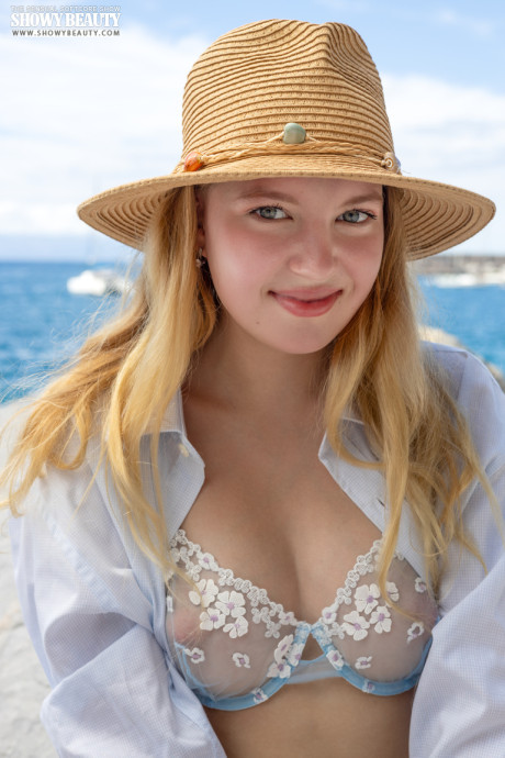 Young young blondie Nikoleta gets completely undressed on a rock by the ocean - #282492