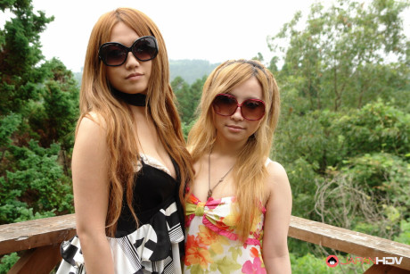 Two Japanese bitches are masturbated on a deck before giving a double bj - #291891