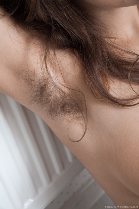 Brunette solo skank girl broad shows off her unshaven armpits and pussy in her bedroom - #204981